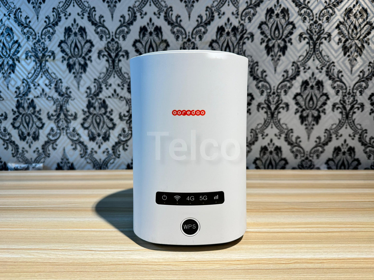 A white ZLT X20 5G/4G wireless router with a visible sim slot, displayed against a patterned background.