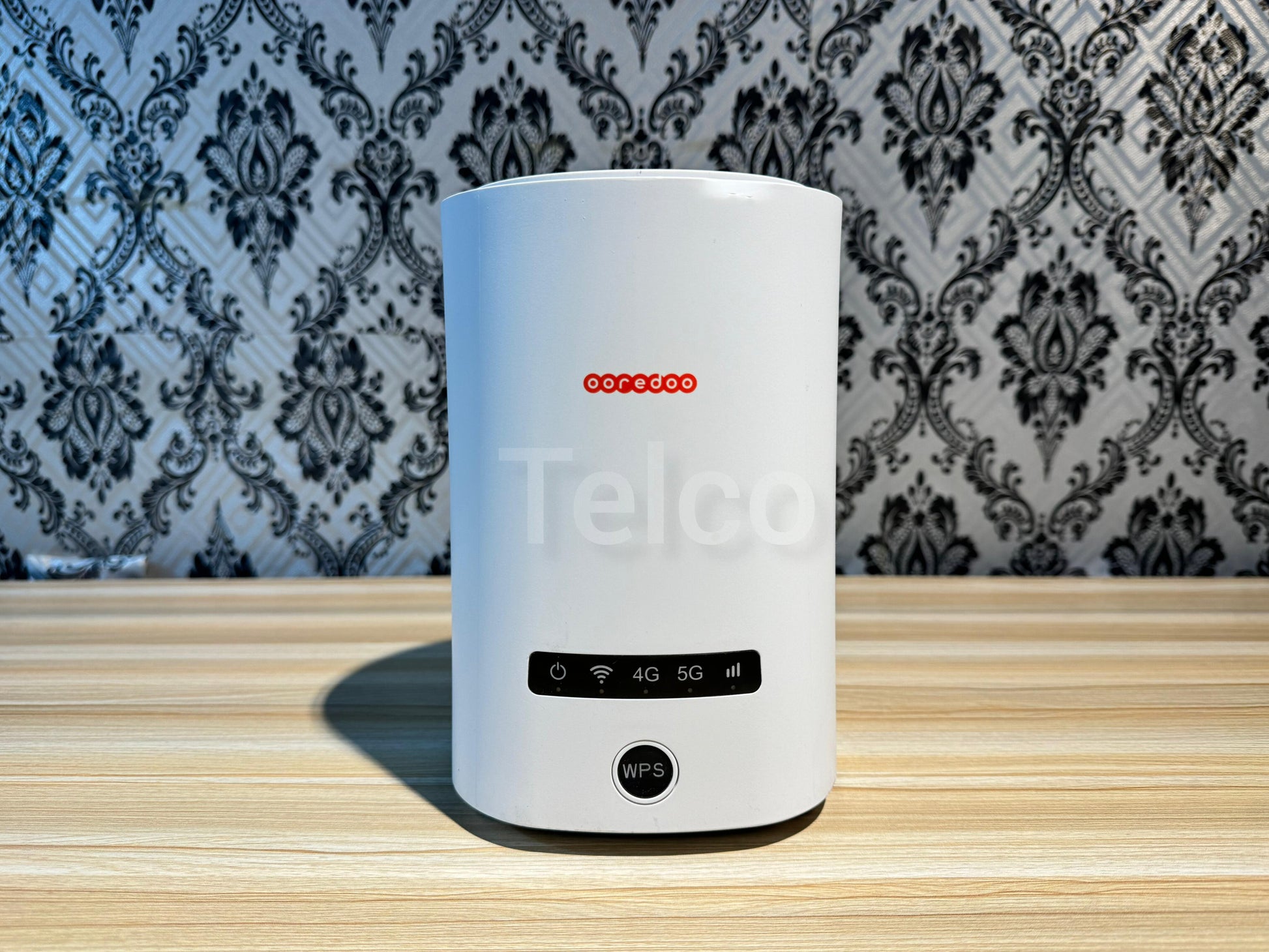 A white ZLT X20 5G/4G wireless router with a visible sim slot, displayed against a patterned background.