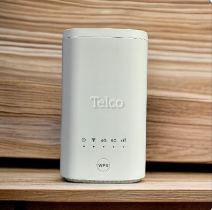 A white 5G wireless router branded 'Telco' placed on a wooden surface, showing connectivity indicators for WiFi, 4G, 5G, and a WPS button.